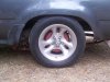 1993 yota drivers side rear wheel paint test red oxide close up.jpg